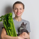 Woman and kitten and celery