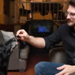 Brett Hartmann gives his dogs Cayley, a six-year-old-Labrador Retriever drops of a cannabis based medicinal tincture to treat hip pain and anxiety, June 8, 2017 at his home in Los Angeles, California. It