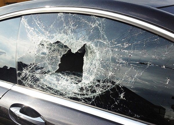 Smashed car window from recent theft in Brooklyn.